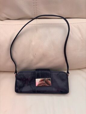 Calvin Klein Navy mini Clutch with Metallic Logo Plate
